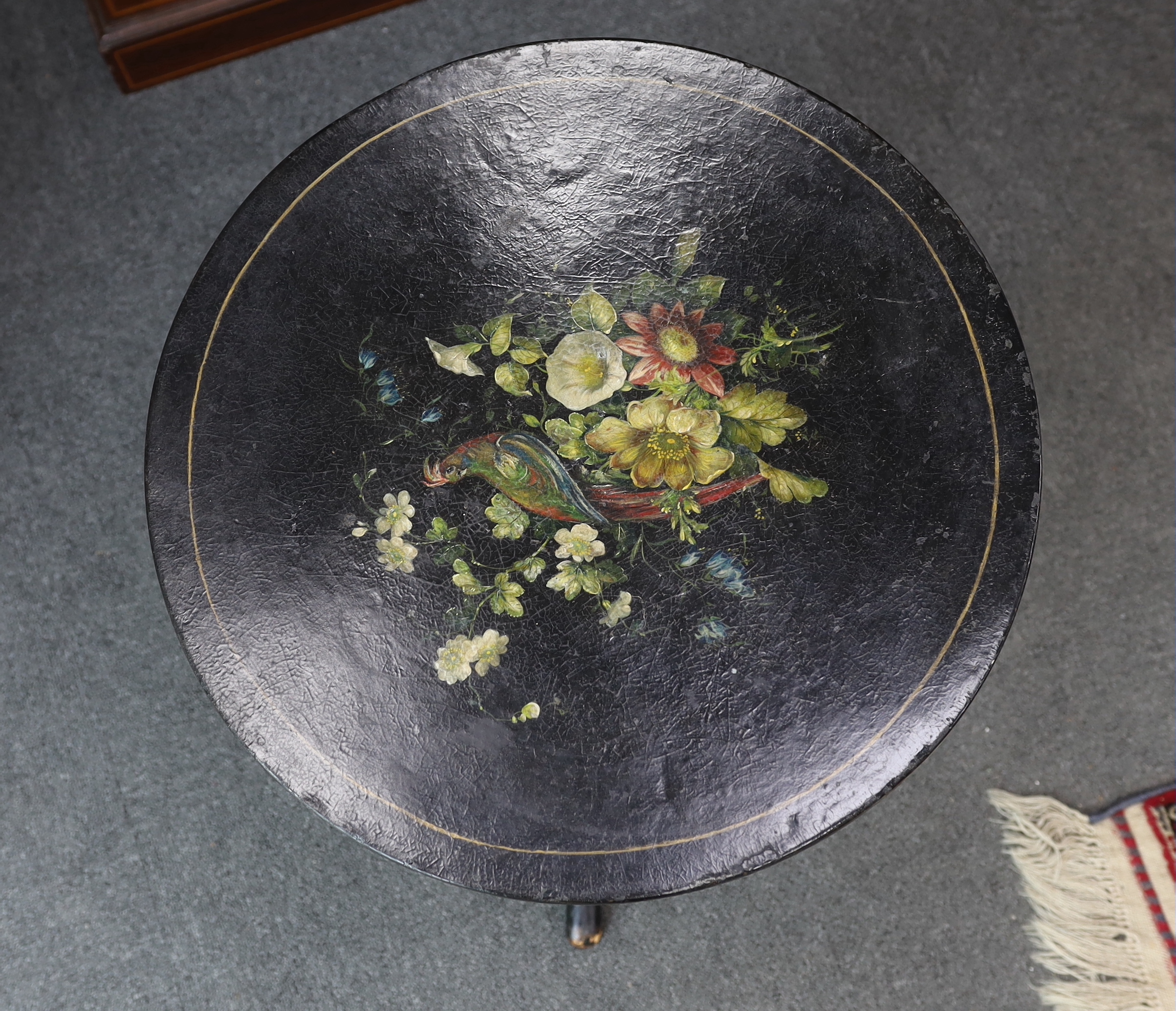 An early 19th century circular painted papier mache tripod wine table, diameter 50cm, height 53cm.